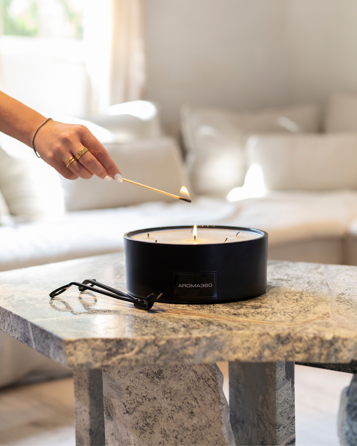 Luxurious 6-wick Déjà Vu candle set inspired by Vogue Brazil, featuring notes of bergamot, rose, and honeyed orchid. Includes a 50oz candle, wick trimmer, and matchbox for an unforgettable sensory experience.