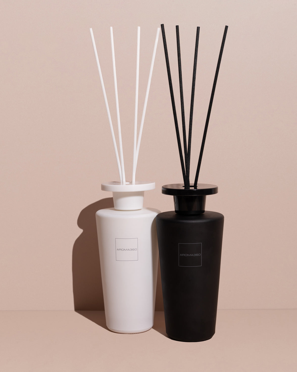 Aroma360 500ml reed diffuser with sleek glass bottle and natural reed sticks, elegantly dispersing fragrance for a long-lasting scent experience.