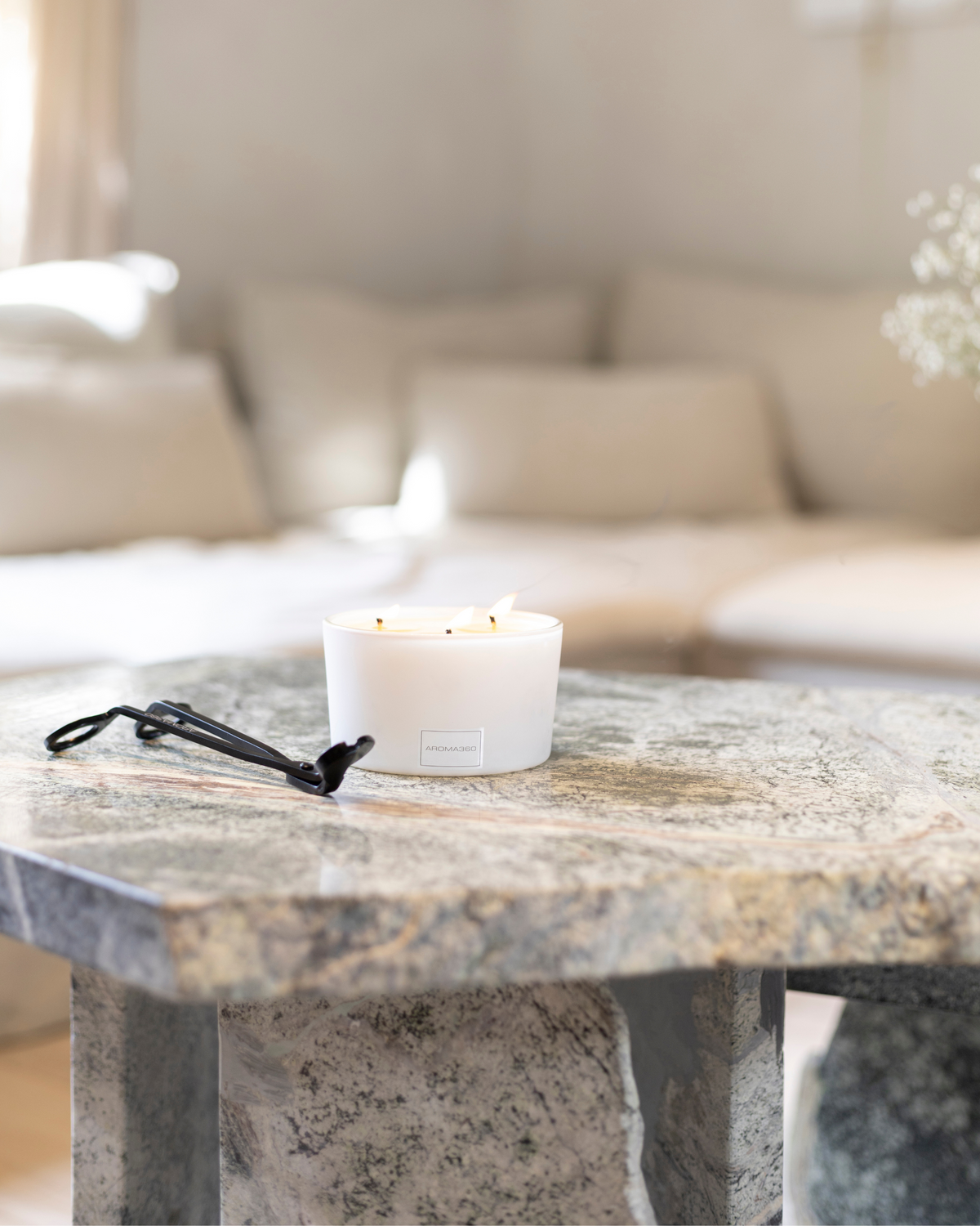 Luxurious 9oz Serene Escape candle inspired by 1 Hotel® Miami Beach, featuring warm sandalwood, Virginia cedar, and delicate iris. A soothing blend with a 50-hour burn time for a refined, tranquil ambiance.